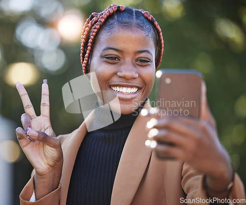 Image of Face, phone selfie and black woman with peace sign at park outdoors. Technology, cellphone and female with hand gesture taking picture or photo on mobile smartphone for happy memory or social media.