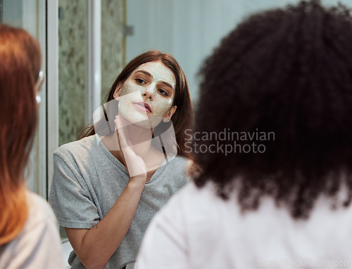 Image of Women, bathroom skincare or face mask bonding in house, home and hotel spa wellness, girls hospitality or healthcare grooming. Friends, people or beauty facial product for wellness cleaning in mirror