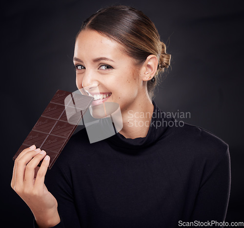 Image of Chocolate, diet and beauty with woman and skincare with healthy candy, luxury and wellness with food and portrait. Happy with calories, cosmetic and cacao dessert with skin against studio background