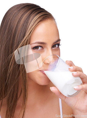 Image of Portrait, milk drink and happy woman in studio, isolated white background or healthy diet. Face of female model, glass and fresh dairy for breakfast, protein and calcium, organic wellness or vitamins