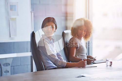 Image of Business people, women and office at desk for meeting, innovation or planning for marketing strategy. Black woman, focus and business meeting for goal in modern office, teamwork or company vision