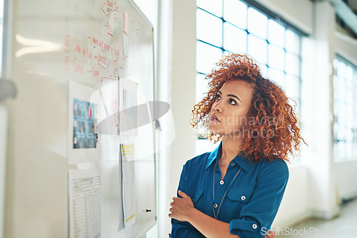 Image of Black woman, thinking and planning idea on whiteboard in office for creative design, strategy management or planning. African female designer, goals vision and presentation review or analytics data