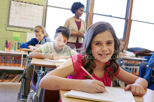 Image of Learning, happy and girl portrait in classroom with notebook for lesson notes and knowledge. School kids, education and development of middle school children writing in books with focus.