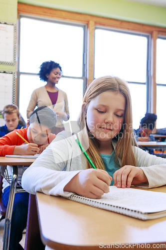 Image of School, girl and writing in book, education and studying for test, exam and learning in classroom. Teacher, female student and learners with notebooks, focus and thinking for notes and concentration