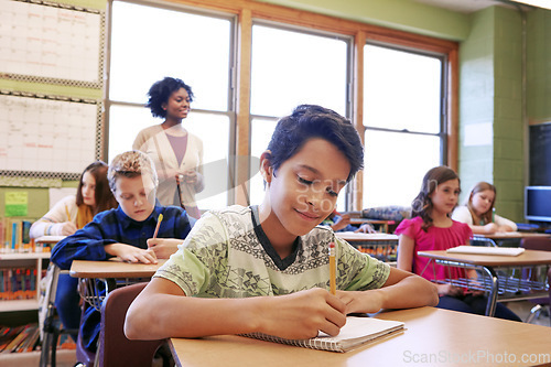 Image of Child, education or student in classroom writing in notebook for learning, research or study for exam with teacher. Scholarship, thinking or happy kid in school for test, academy or assessment