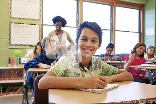 Image of Happy, education portrait or kid in classroom writing in notebook for learning, research or study for exam with teacher. Scholarship, thinking or student in school for test, academy or assessment