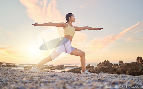 Image of Beach, yoga or woman stretching in fitness training, body workout or exercise for natural balance in Miami, Florida. Mindfulness, breathing or healthy zen girl exercising at sunset with calm peace