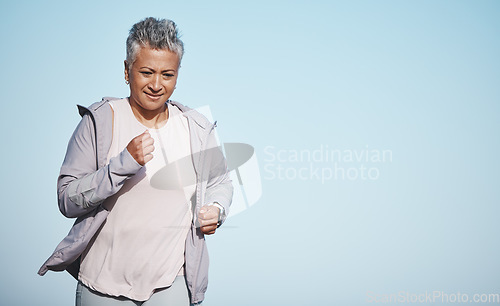Image of Senior woman, fitness running and blue sky outdoor exercise for retirement sports wellness, health workout and cardio training. Elderly athlete, focus and runner freedom and marathon lifestyle