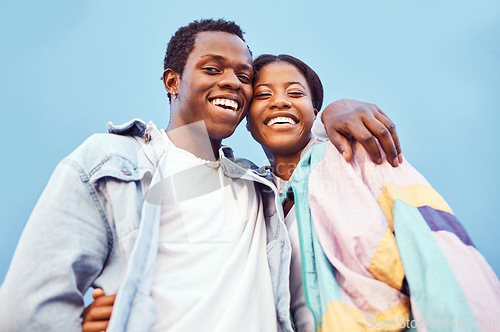 Image of Couple, love or bonding hug by city wall background in trust, security or support in relax urban date, fun activity or holiday. Portrait, happy smile or black woman and man embrace on building mockup