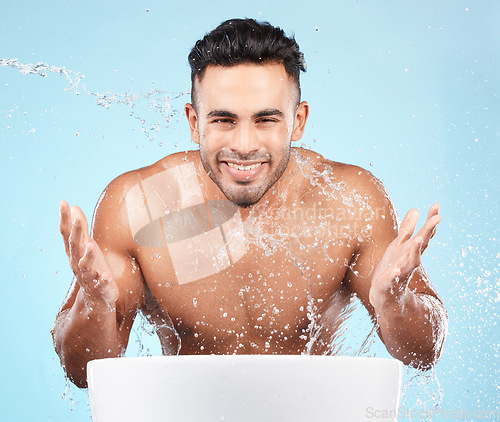 Image of Cleaning, water splash and portrait of man happy with self care routine, facial hygiene and body hygiene wash. Water drop, bathroom skincare hydration and beauty model with health wellness treatment
