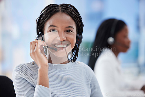 Image of Black woman, portrait and call center headset in telemarketing office, contact us company or b2b sales business. Smile, happy face and customer support consultant in CRM coworking space on help deal
