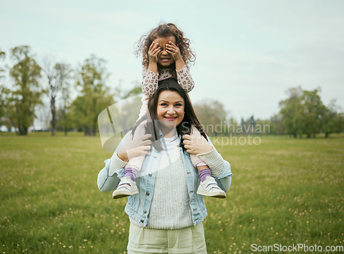 Image of Mom, girl and sitting on shoulders outdoor for happiness, bonding or care in nature together in spring. Woman, kid and happy family for vacation, love or play on grass field for fun at Toronto park