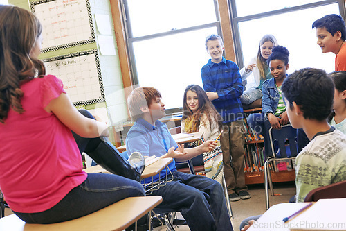 Image of School, children and talking about education in a classroom to learn, study and share knowledge. Boy and girl group discussion with students in class learning for future, development and growth