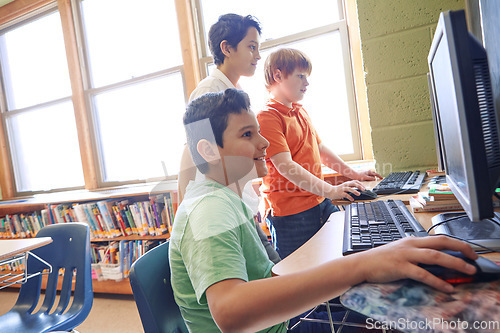 Image of Learning, education and students on computer in classroom or middle school. Development, pc and group of boys or kids studying computers, information technology and software, coding or programming.