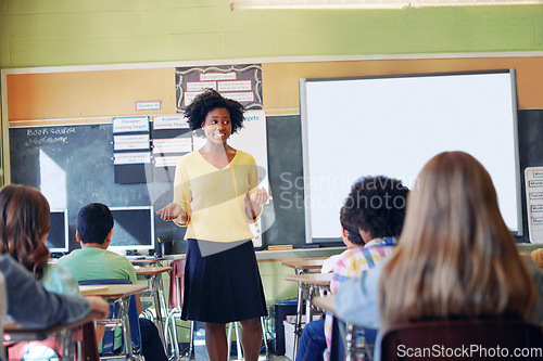 Image of African woman, teacher and classroom discussion with students for education, learning support and knowledge development. Happy black female, preschool classroom and tutor teaching young children