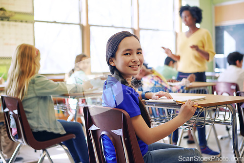 Image of School, child portrait and education in a classroom with a lesson to study and learn knowledge. Diversity students or children in class while learning for future, development and growth with teacher