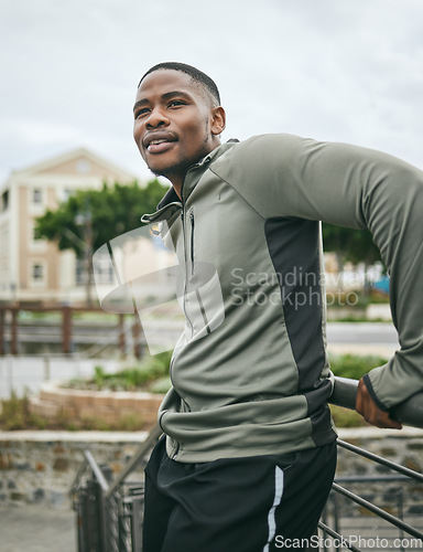 Image of Fitness, relax or tired black man on a break in running training, exercise or workout in city of Miami, Florida. Resting, runner or healthy sports athlete thinking of body goals, motivation or vision