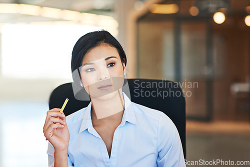 Image of Idea, planning and vision with a business asian woman in her office thinking about the future of her company. Mission, mindset and growth with a female employee holding a pencil while sitting at work