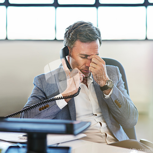 Image of Elderly businessman, headache and telephone call in office for online communicaton and tired employee. Frustrated man, head pain and deadline stress or employee anxiety for corporate phone call