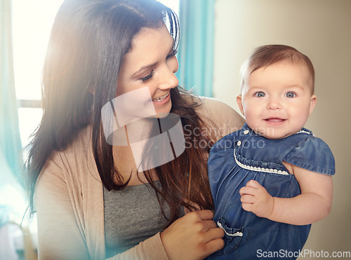 Image of Mother, bonding or baby girl portrait in house living room or family home bedroom in support trust, security or love carrying. Smile, infant or happy mom holding child in comfort for profile picture