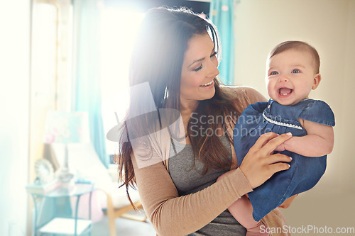 Image of Mother, bonding or laughing baby girl in house living room or family home bedroom in support trust, security or love carrying. Smile, infant or happy mom holding child in funny or comic tickling game