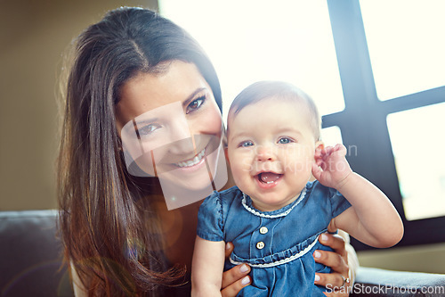 Image of Mom, bonding and baby girl portrait in house living room or family home sofa in support trust, security and love hug. Smile, infant and happy mother holding child for social media and profile picture