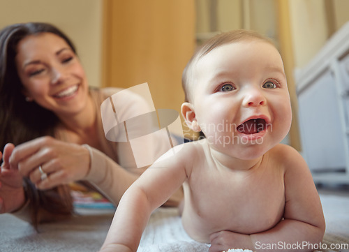 Image of Happy, mother and baby playing in their home together with fun, love and playful bonding. Happiness, smile and young mom spending time with her infant girl child in their house for child development.