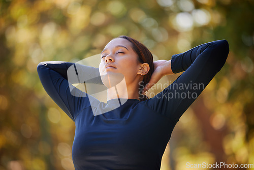 Image of Black woman in outdoor park, breathing in natural fresh air in and morning fitness in Cape Town. Healthy spiritual wellness, zen breathe in meditation and young lady stretching arms with eyes closed