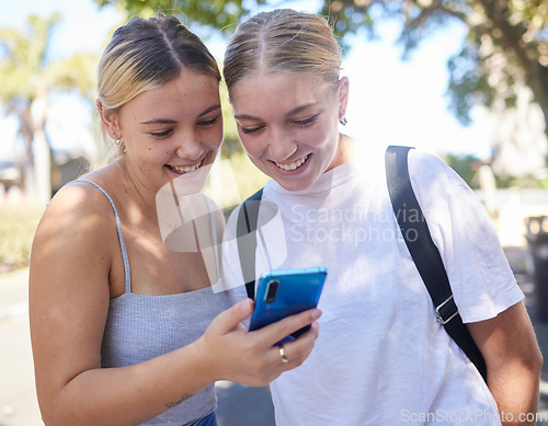 Image of Smartphone, park and student friends on internet, social media post or website information search for university, campus or college. Youth women reading mobile newsletter for education mental health