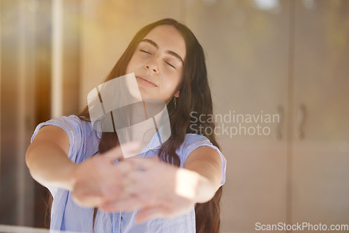 Image of Wake up, stretching and morning with a woman in a bedroom, sitting after sleeping or rest at home. Peace, relax and stretch with a female waking up in her bed feeling fresh on the weekend or time off