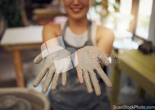 Image of Pottery, messy and clay hands of a woman at a workshop for creative small business, art and working on design. Mud, show and professional artist in a studio for handmade artistic creativity at work