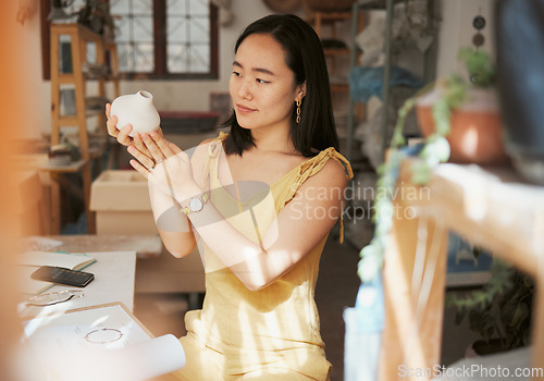 Image of Woman, pottery product and designer in workshop, creative studio and manufacturing startup. Female small business owner, ceramic talent and artist working with sculpture, creativity and craft process