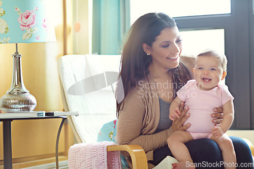 Image of Mom, bonding or laughing baby on nursery chair, house living room or family home furniture in trust, love or support. Smile, happy mother and infant girl in funny, goofy or comic or game for children