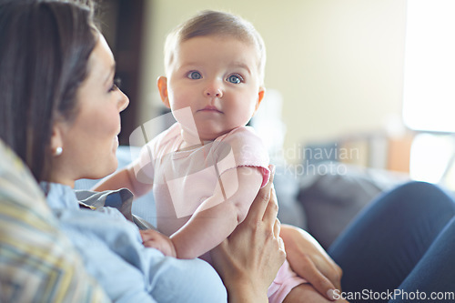 Image of Woman, bonding and mother with baby girl on house living room, nursery or family home sofa in trust, support or love. Curious, infant and child with mom in relax, security or safety comfort on couch