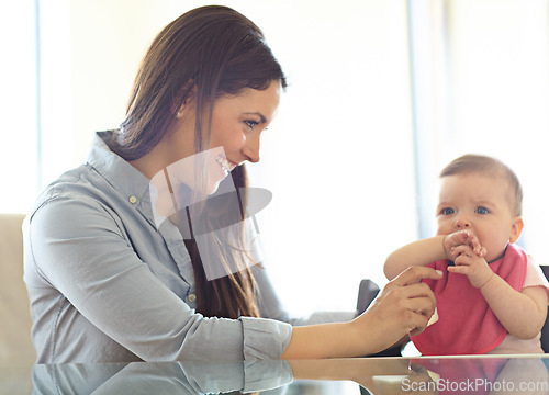 Image of Mother, baby child and chair for play, bonding and love at table with smile, morning and happiness. Mom, infant kid and happy together in family home for development, help or care in living room