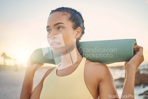 Image of Face, fitness and woman with yoga mat at beach preparing for workout, training or exercise. Zen chakra, meditation and female yogi thinking about pilates for health, wellness and mobility at sunset.