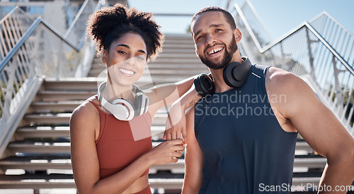 Image of Happy black couple, stairs and portrait for training with music, smile and outdoor for workout together. Exercise team, couple and support for body health, summer training and wellness in Cape Town