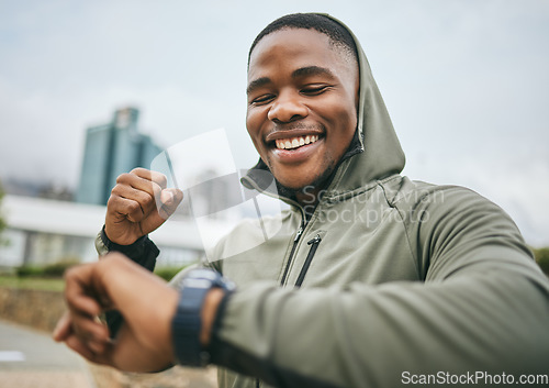 Image of Fitness, goal and black man reading watch for training progress, running celebration and exercise success in Nigeria. Monitor, celebrate and runner happy with cardio performance on smart watch