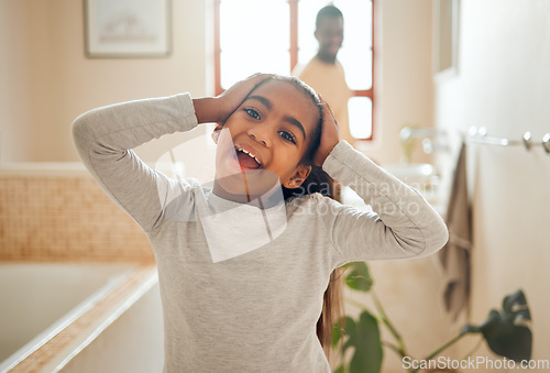 Image of Wellness, wow and portrait of girl in bathroom with father for morning routine, hygiene and cleaning. Black family, smile and face of young child for skincare, healthy lifestyle and self care at home