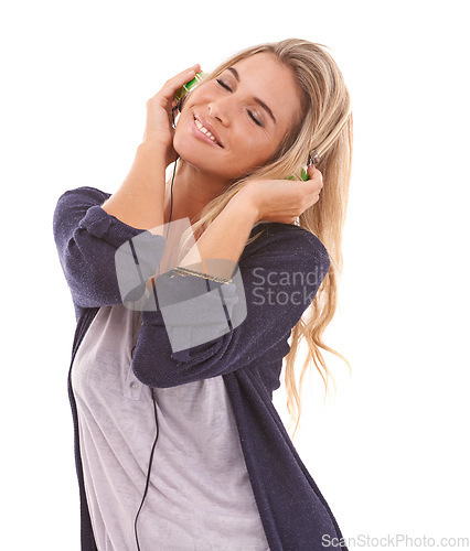 Image of Music, smile or happy woman in studio listening to radio audio or song playlist on white background. Headphones, eyes closed or beautiful girl enjoys dancing, relaxing or streaming a calm sound track