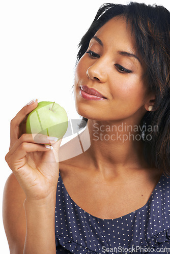 Image of Health, apple and smile with black woman thinking for diet, nutrition or organic choice. Food, vitamins and fiber snack with isolated Brazil girl and fruit for natural, weight loss or clean eating