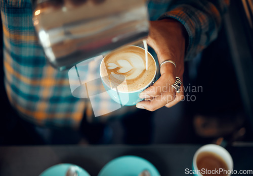 Image of Coffee, milk and hands of man in cafe for cappuccino, breakfast and caffeine beverage. Relax, espresso and dairy with barista in coffee shop with latte art for retail, mocha and drink preparation