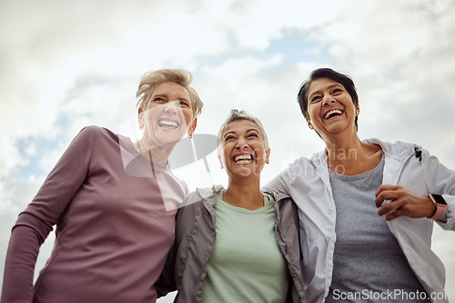 Image of Diversity, happy women and laughing for sports, fitness and support on mockup sky background. Low angle, senior female group and exercise friends excited for community wellness, freedom or motivation