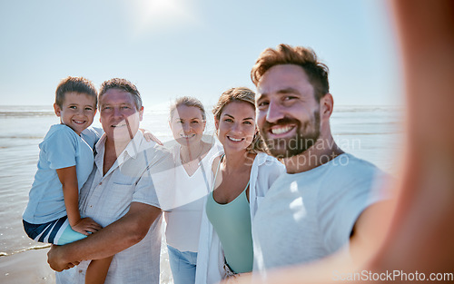 Image of Family, beach and selfie while on vacation in summer with child, parents and grandparent together for travel update while a smile, love and care. Portrait of men, women and kid at sea for a holiday