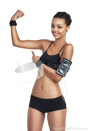 Image of Portrait, strong arm and black woman point at bodybuilder training, fitness workout and health exercise results. Girl listening to music, radio podcast and studio model isolated on white background