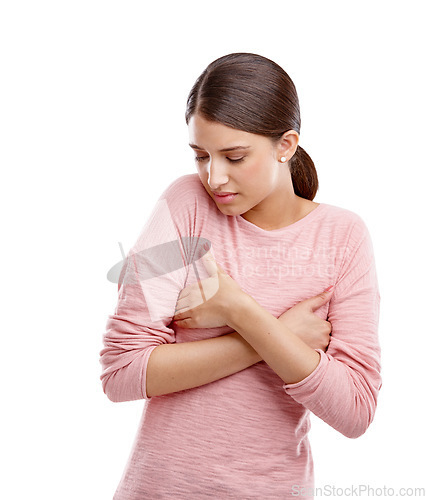 Image of Gender dysmorphia, woman and anxiety of a model holding breast feeling stress. White background, vulnerable and isolated person with worry for breast cancer awareness or health care in a studio