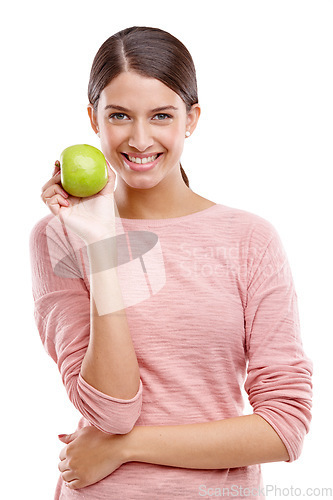 Image of Health, apple and smile with portrait of woman for nutrition, diet and weight loss choice. Fiber, food and vitamins with isolated face of girl eating fruit for wellness, organic and natural in studio