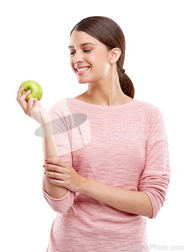 Image of Health, food and smile with apple with woman for nutrition, diet and weight loss choice. Fiber, care and vitamins with isolated face of girl eating fruit for wellness, organic and natural in studio