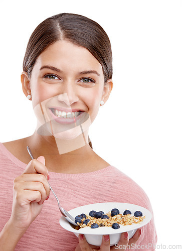 Image of Happy, woman and smile with healthy bowl of breakfast cereal against a white studio background. Portrait of isolated young female model smiling holding muesli for food health, nutrition or fiber