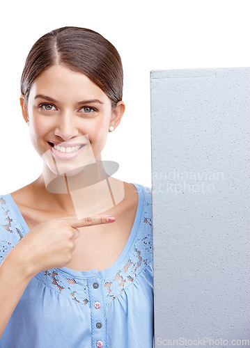 Image of Portrait, pointing and poster with a woman in studio isolated on a white background holding a blank sign for branding. Logo, marketing and brand with a female showing mockup space for advertising